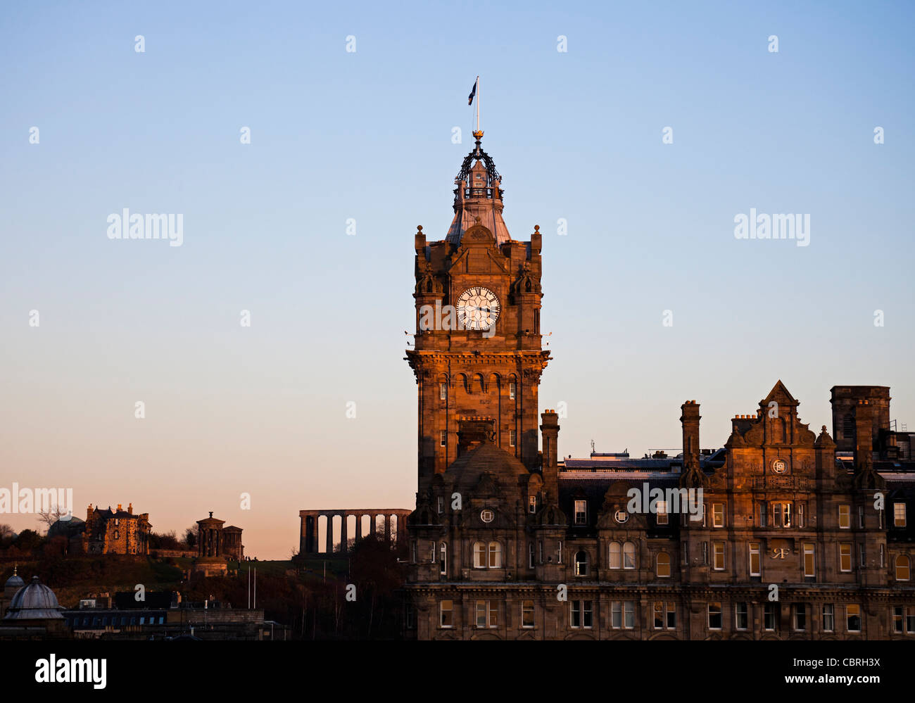 Balmoral Hotel and Calton Hill Edinburgh at sunset, Scotland Europe Stock Photo