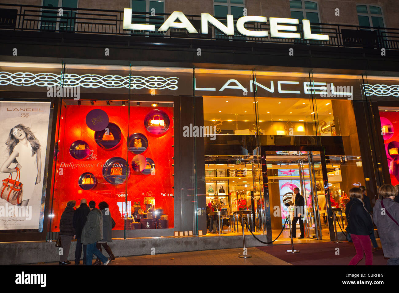Paris, France, Women Shoppers, Window Shopping, Luxury Clothing Store, Lancel, Shop Front, Windows at Night on Avenue Champs ELysees, mode labels Stock Photo