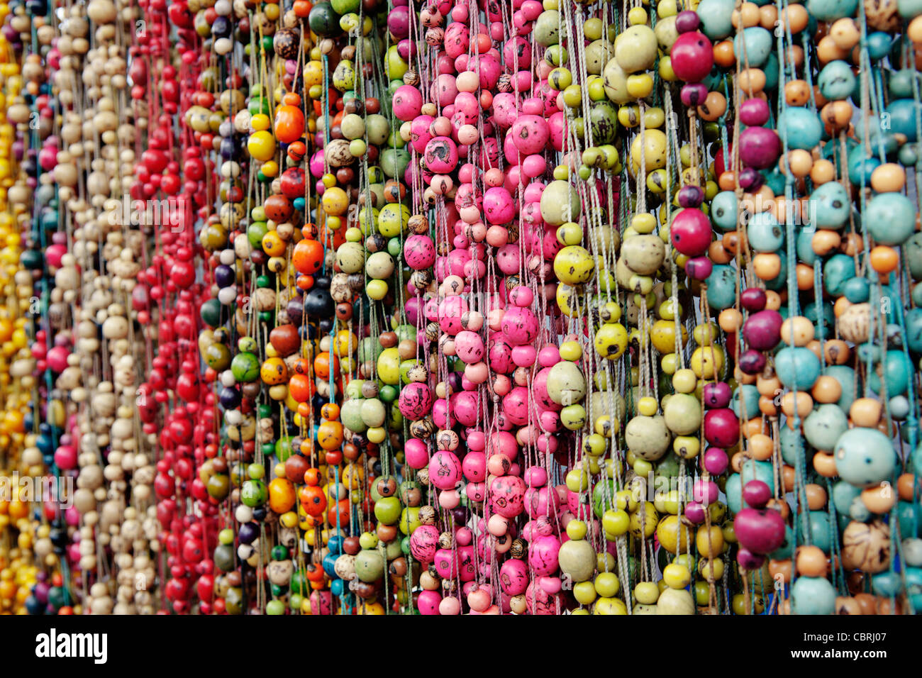 Hanging beads in craft market, Ecuador Stock Photo - Alamy