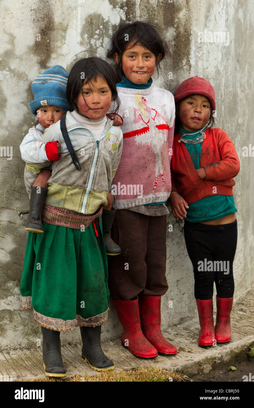 Group Of Dirty And Poorly Dressed Kid Due To The Lack Of Education And Basic Hygiene Services Living In A Rural Area Stock Photo