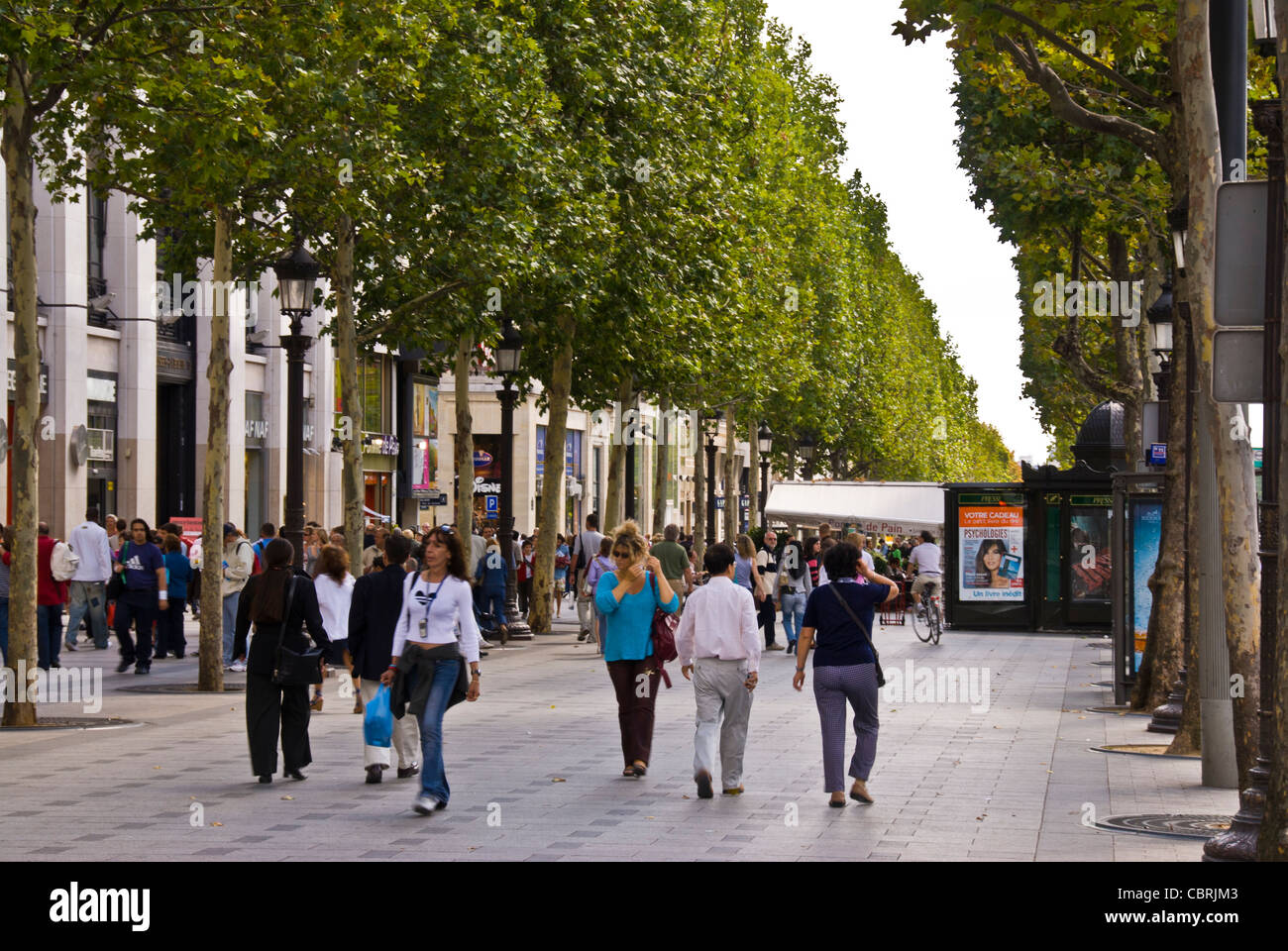 Paris, France, Crowd of people on Parisian busy Shopping street scene, Avenue. Champs Elysees busy, Daytime, teenagers walking outside, streets of Paris, centre Paris, lively parisian street scene, active travel rear view Stock Photo