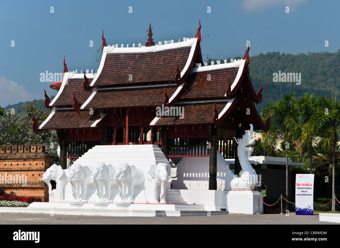 Thai Buddhist temple style building with white elephant statues by ...