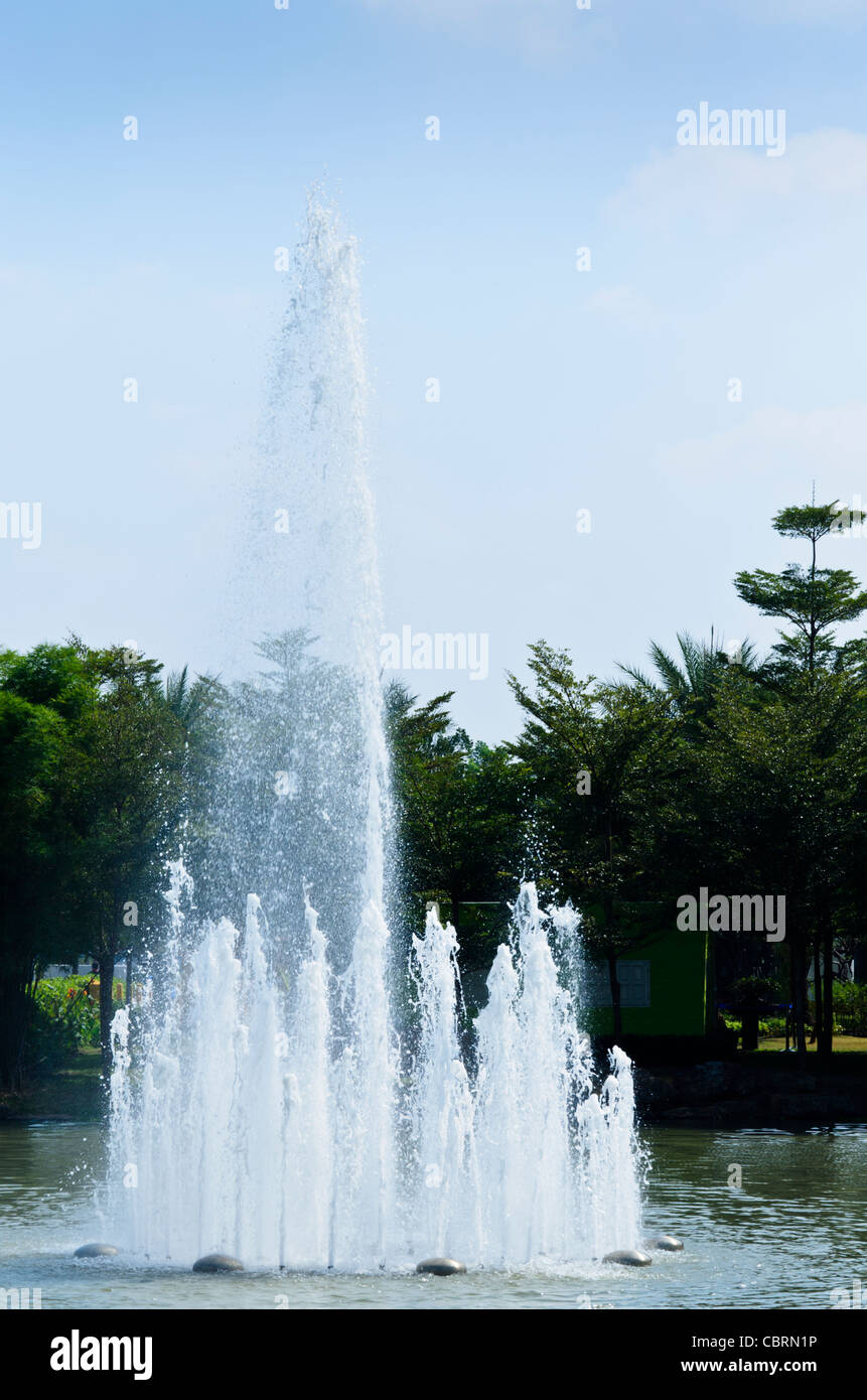 Fountain jetting up water in lake at Royal Flora Ratchaphruek in Chiang Mai Thailand Stock Photo