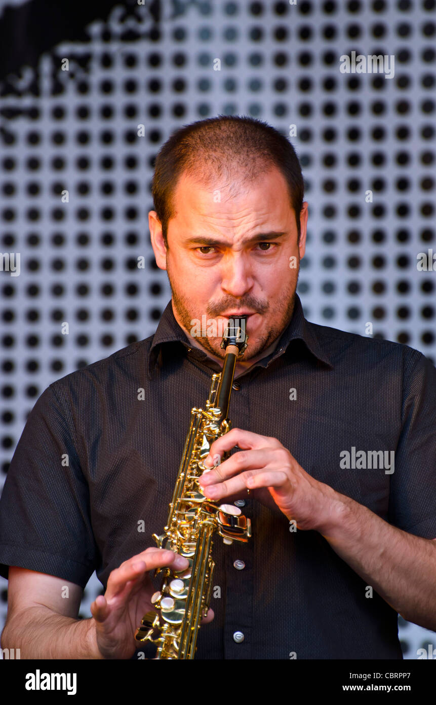 Tenor saxophone player with the Spanish band Radio Cos playing at The Mound, Edinburgh, Scotland