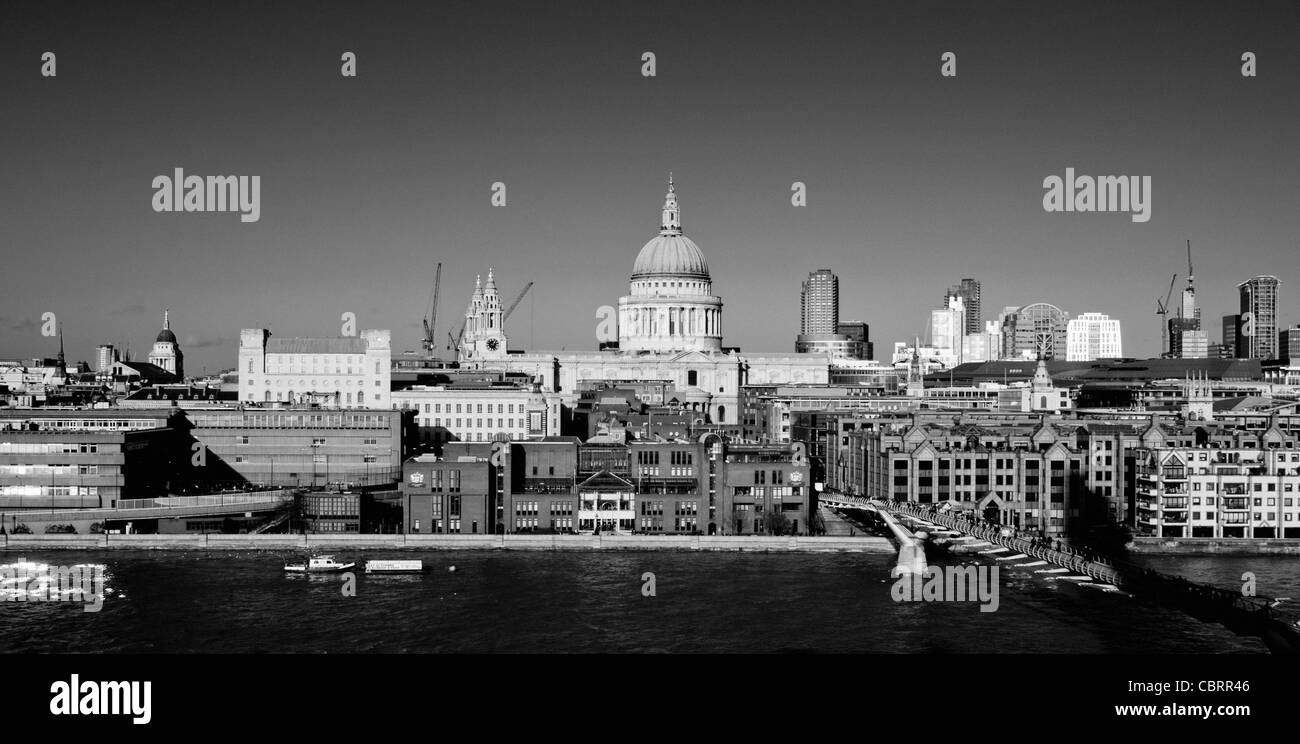 Monochrome image of St Paul Cathedral and City of London School shot from the south bank of river Thames. London. Stock Photo