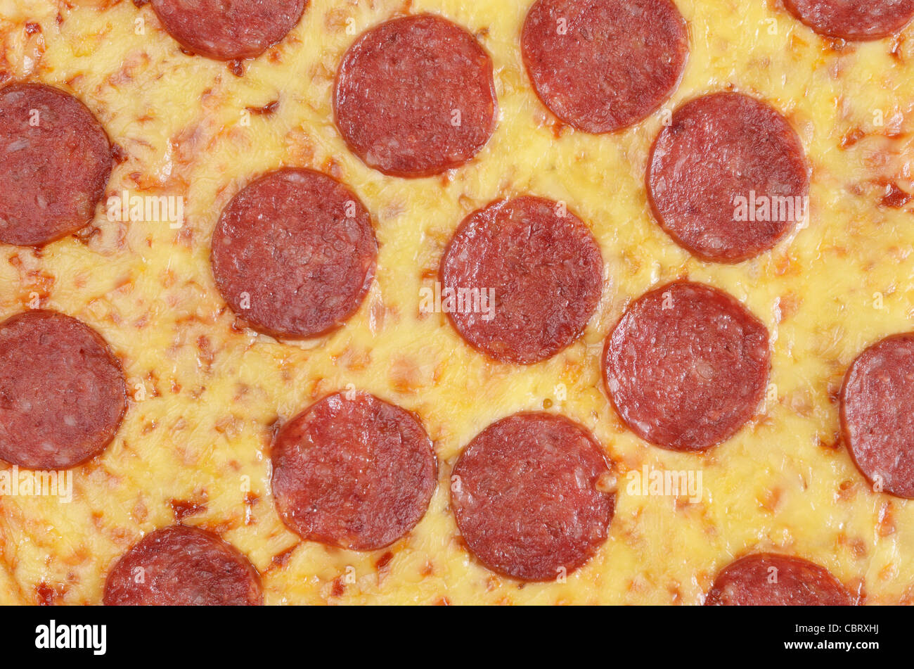 Pepperoni pizza fragment macro photo Stock Photo Alamy