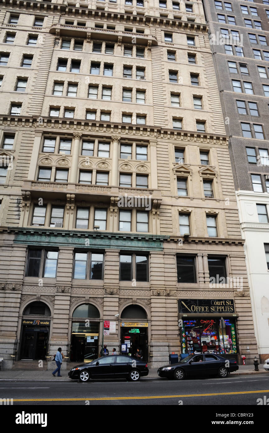 Black cars parked, AfricanAmericans walking Duane Reade Office
