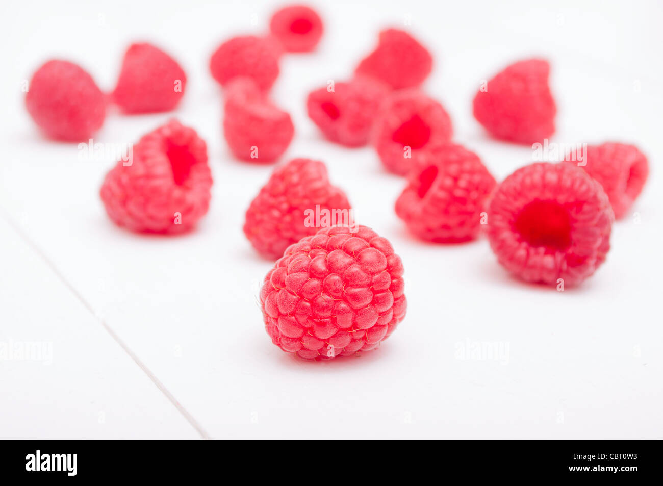 Fresh Ripe Raspberries on White Wooden Table Stock Photo
