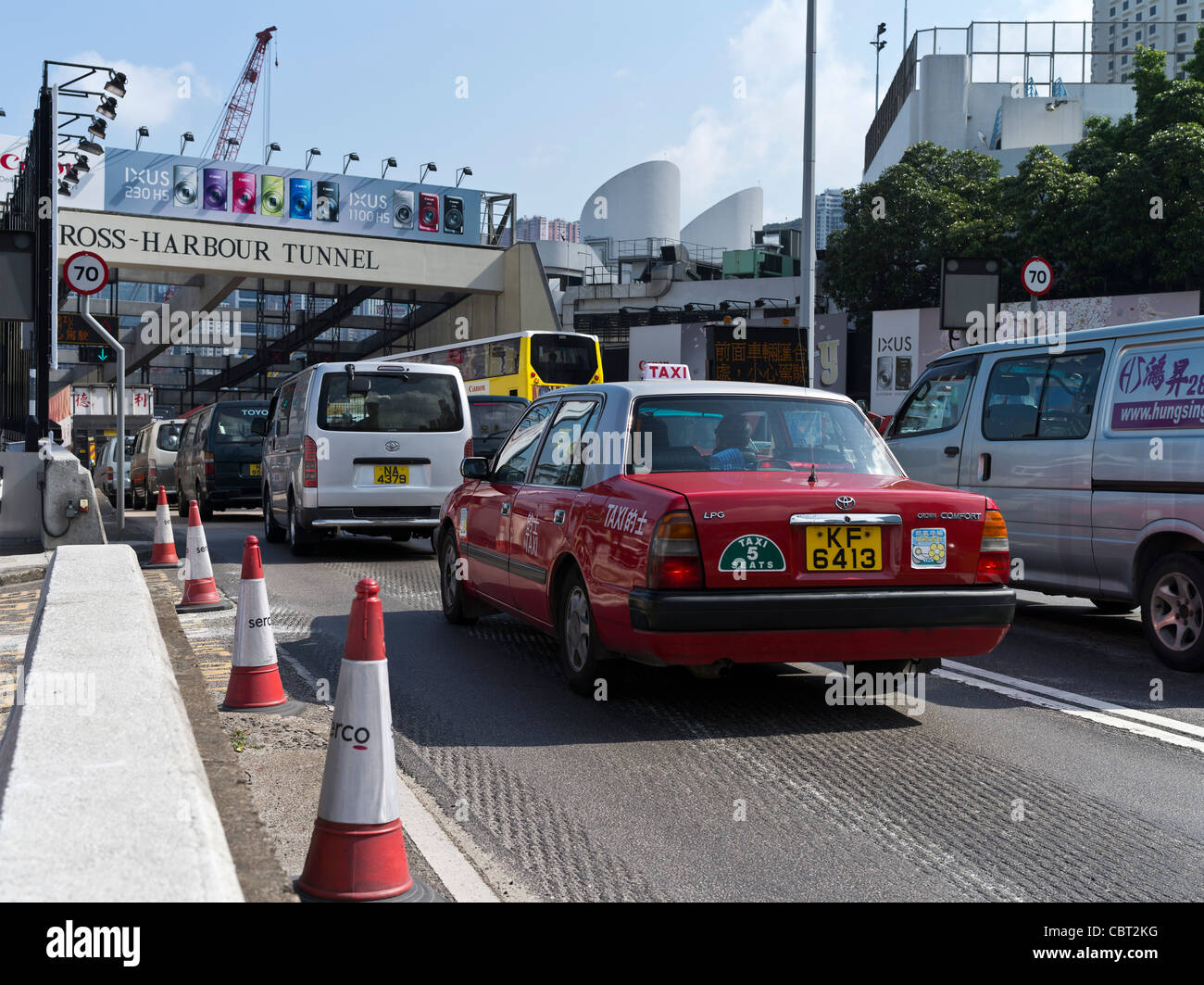 dh Harbour Tunnel CAUSEWAY BAY HONG KONG Red taxi car busy traffic entering Cross Harbour Tunnel island Stock Photo