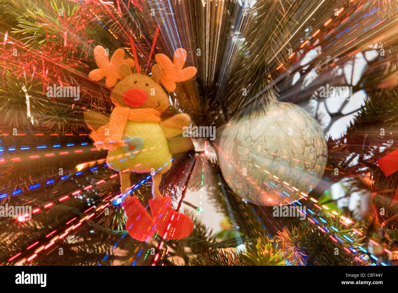 Christmas ornaments in a pine with a lighting effect as a concept of Christmas is coming Stock Photo