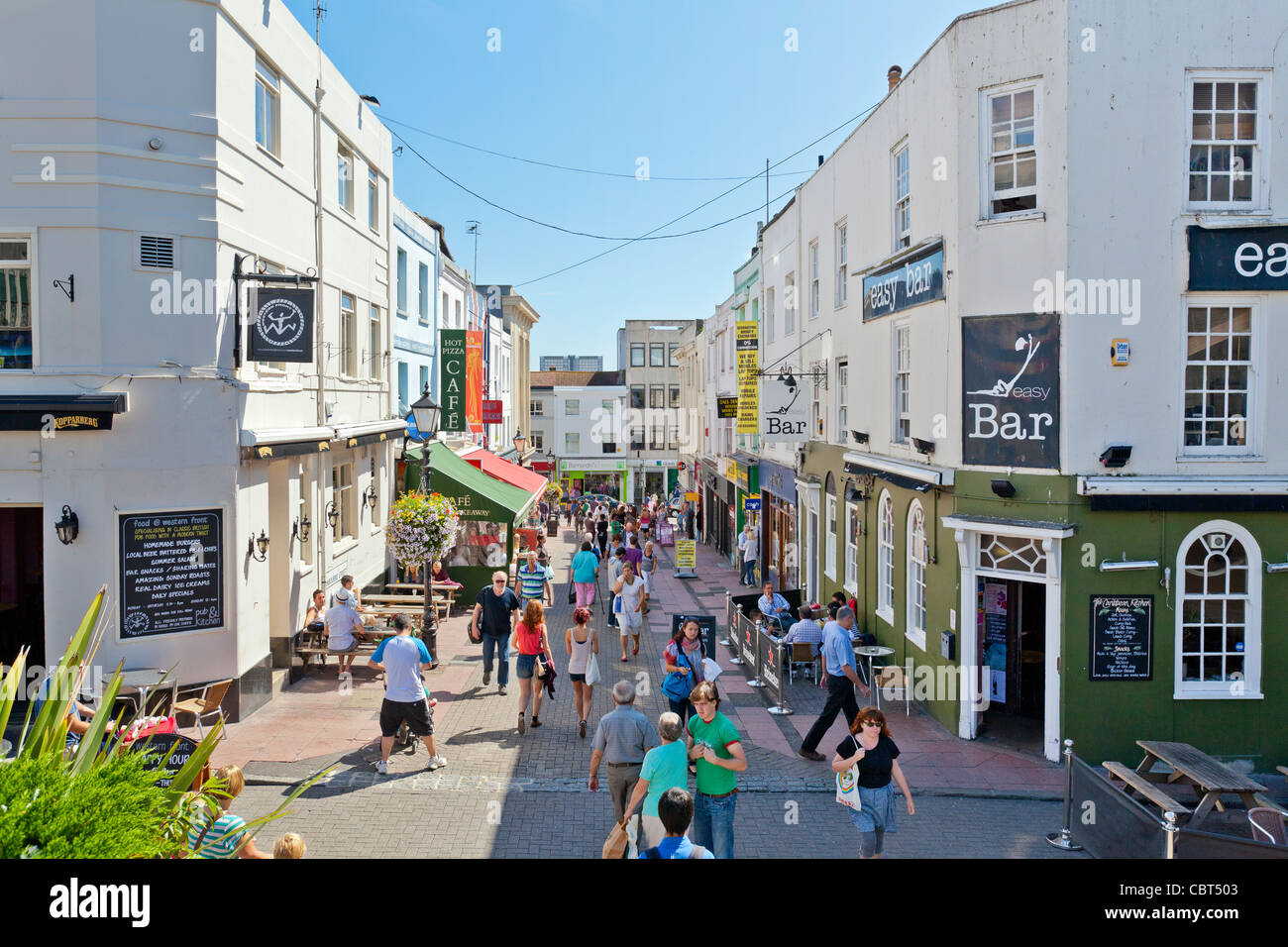 Shoppers walking on Cranbourne Street in downtown Brighton, England. Stock Photo