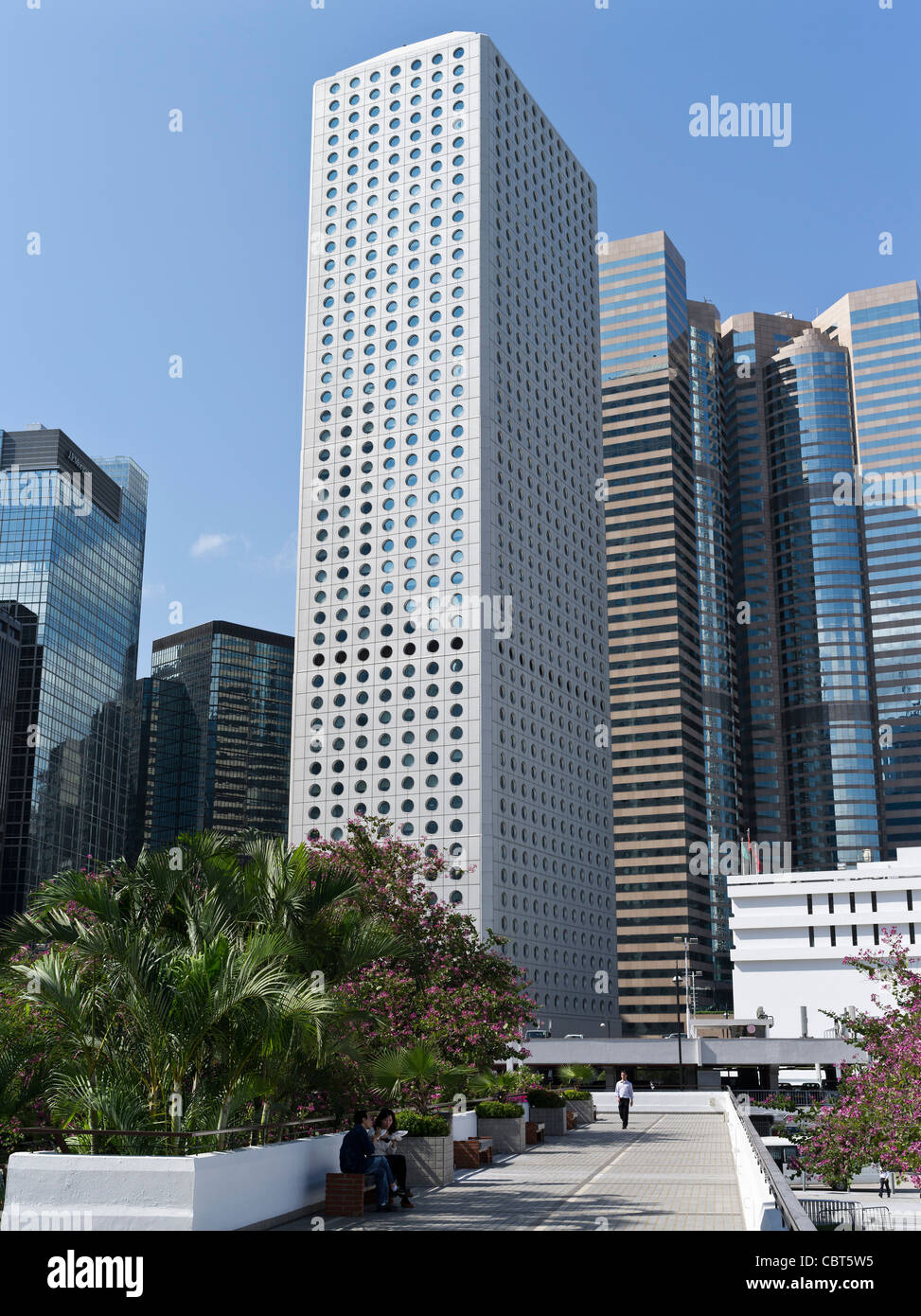 dh  CENTRAL HONG KONG People relaxing City Hall Memorial garden Jardine House Exchange Square business tall buildings towers daytime tower Stock Photo