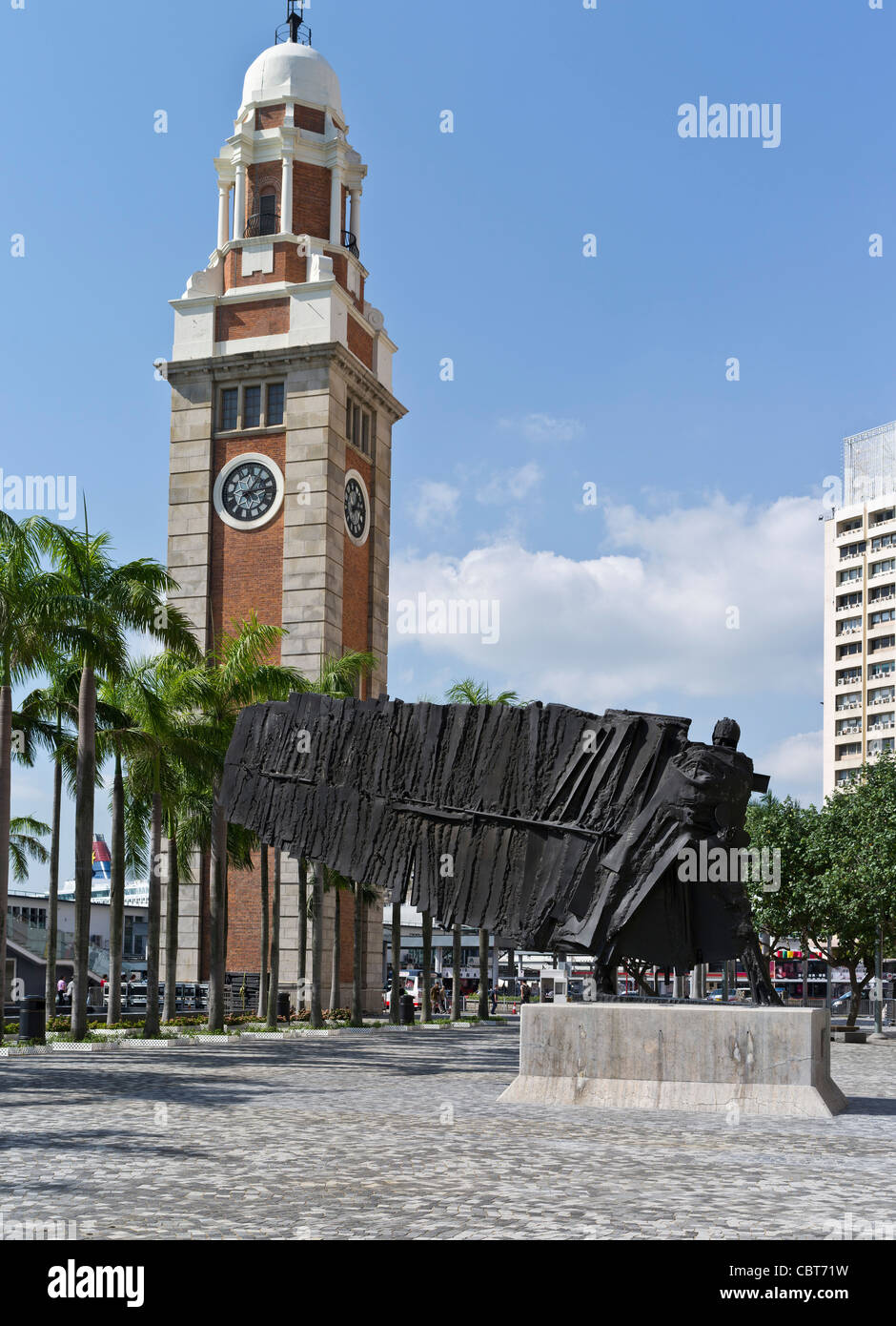 dh The Flying Frenchman TSIM SHA TSUI HONG KONG sculpture by Cesar and Old Clock Tower kowloon art outdoor new modern clocktower Stock Photo