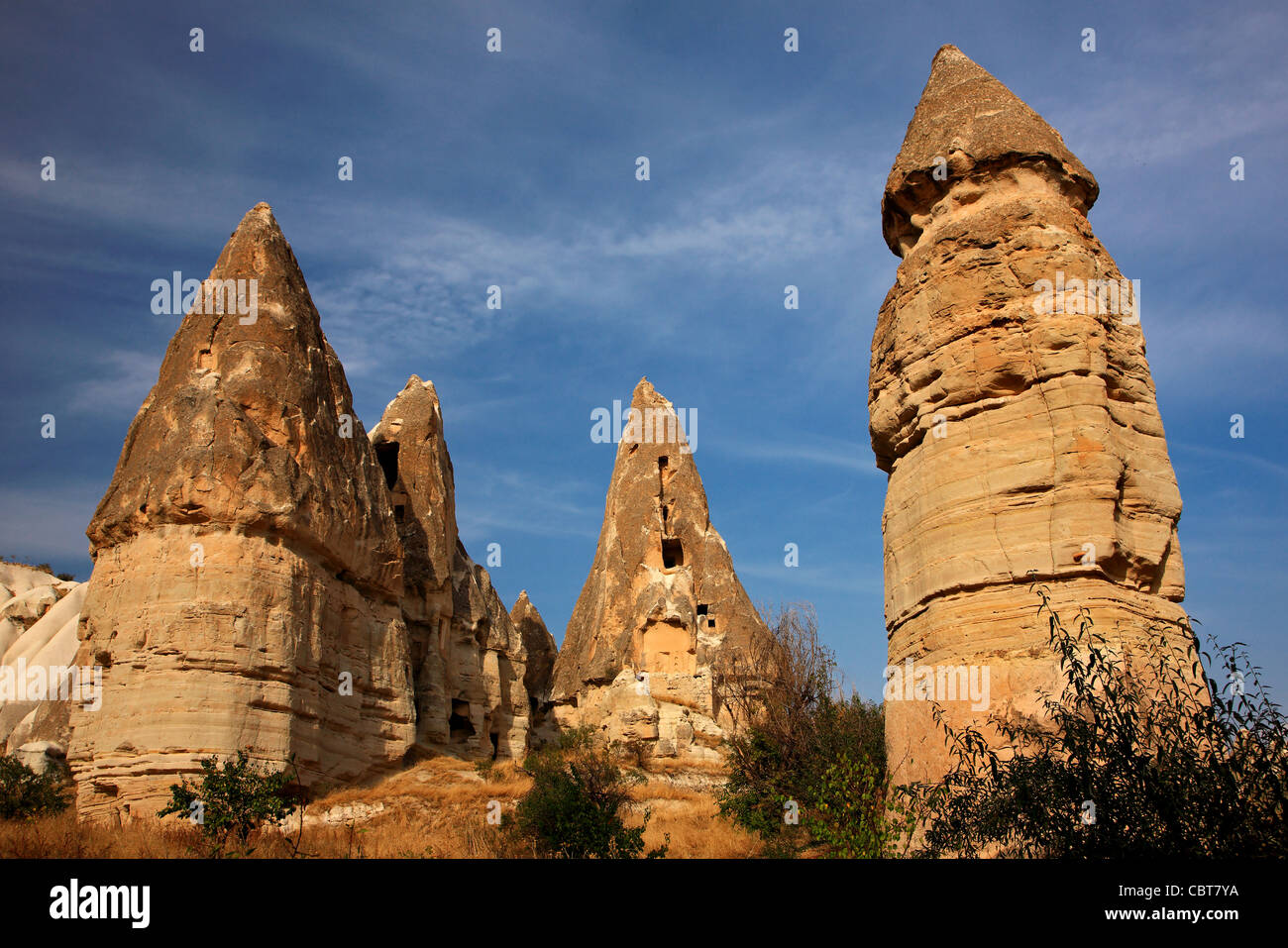 Impressive "fairy chimneys" in Pigeon valley, close to Goreme town, Nevsehir, Cappadocia, Turkey Stock Photo