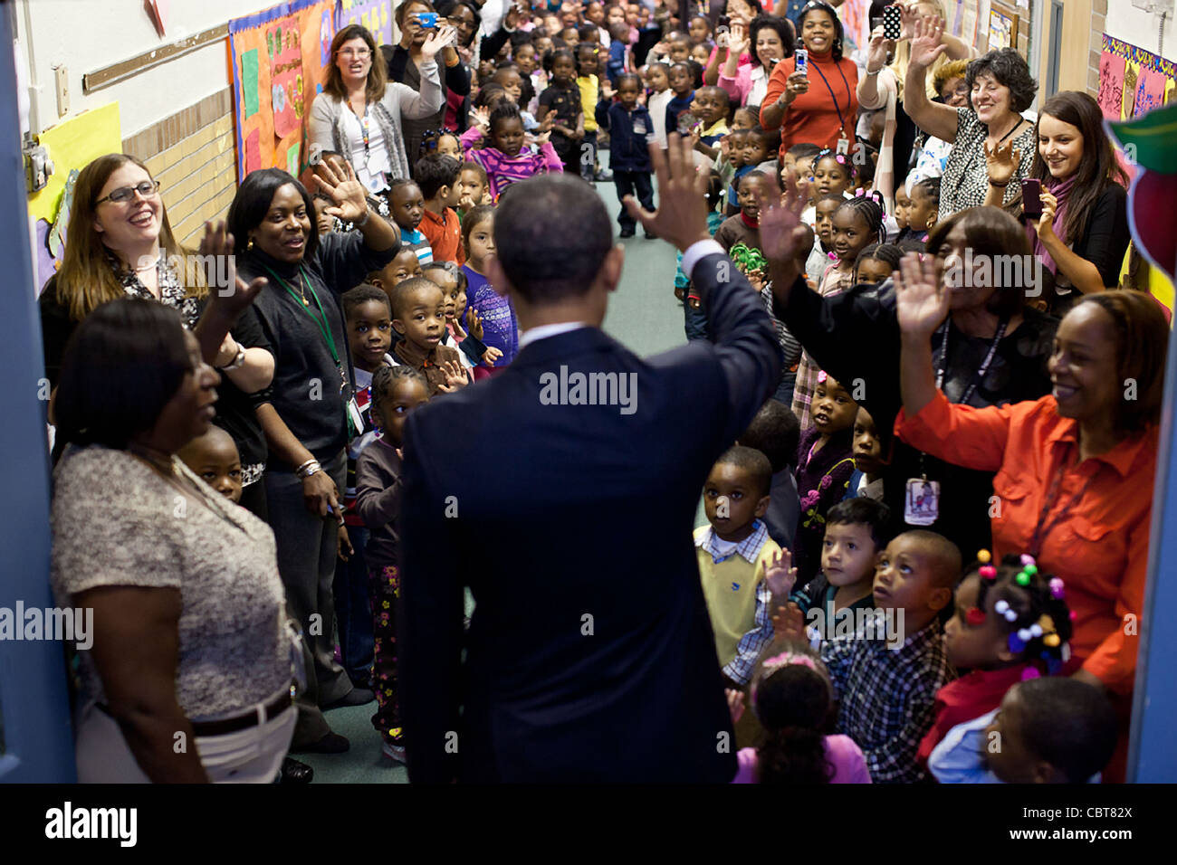 President Barack Obama says goodbye to students after a visit to the Yeadon Regional Head Start Center November 8, 2012 in Yeadon, PA. Stock Photo