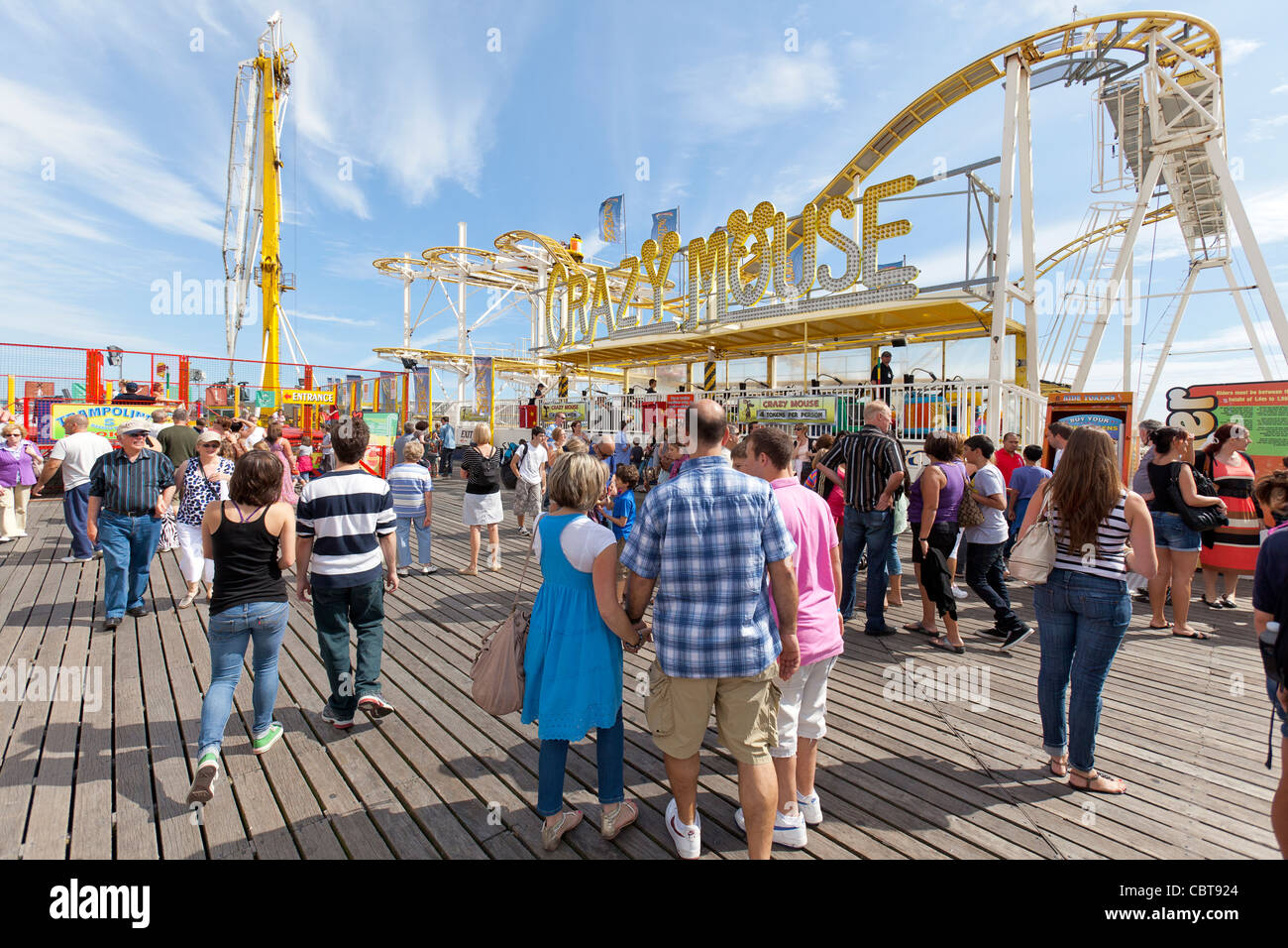 People on holiday and vacation enjoying themselves on amusement park ...