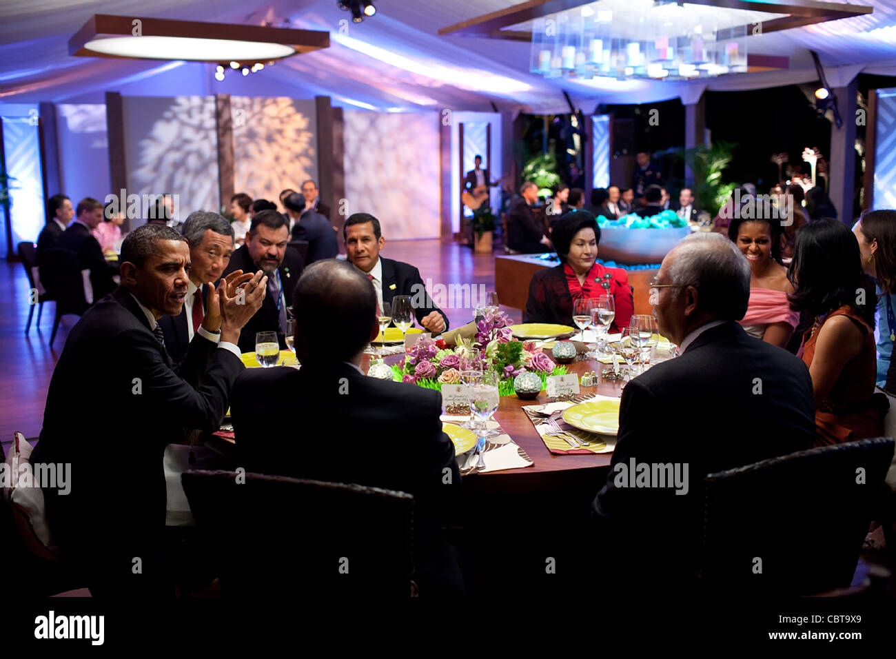 President Barack Obama and First Lady Michelle Obama host a dinner for leaders during the APEC summit November 12, 2011 in Honolulu, Hawaii. Stock Photo
