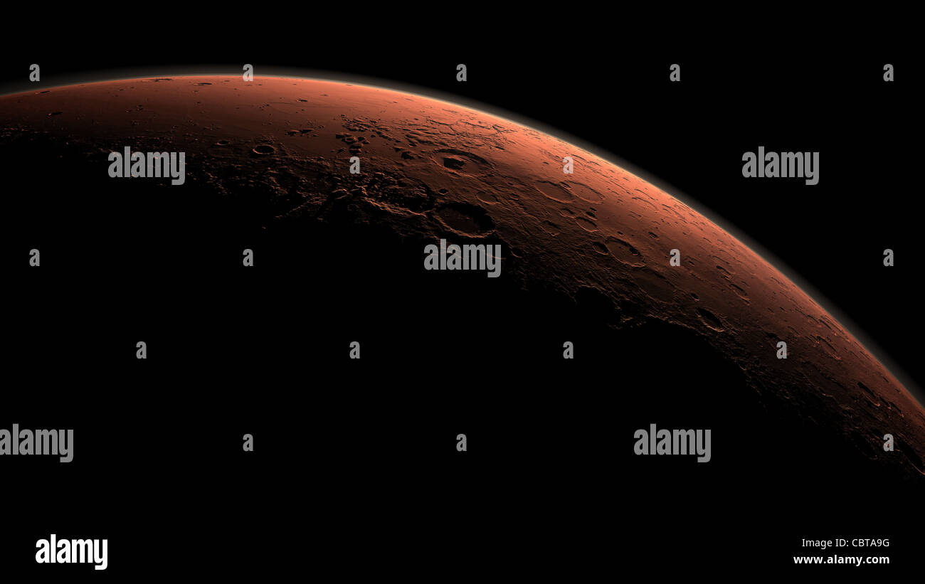 Craters beginning to catch morning light on the planet Mars Stock Photo