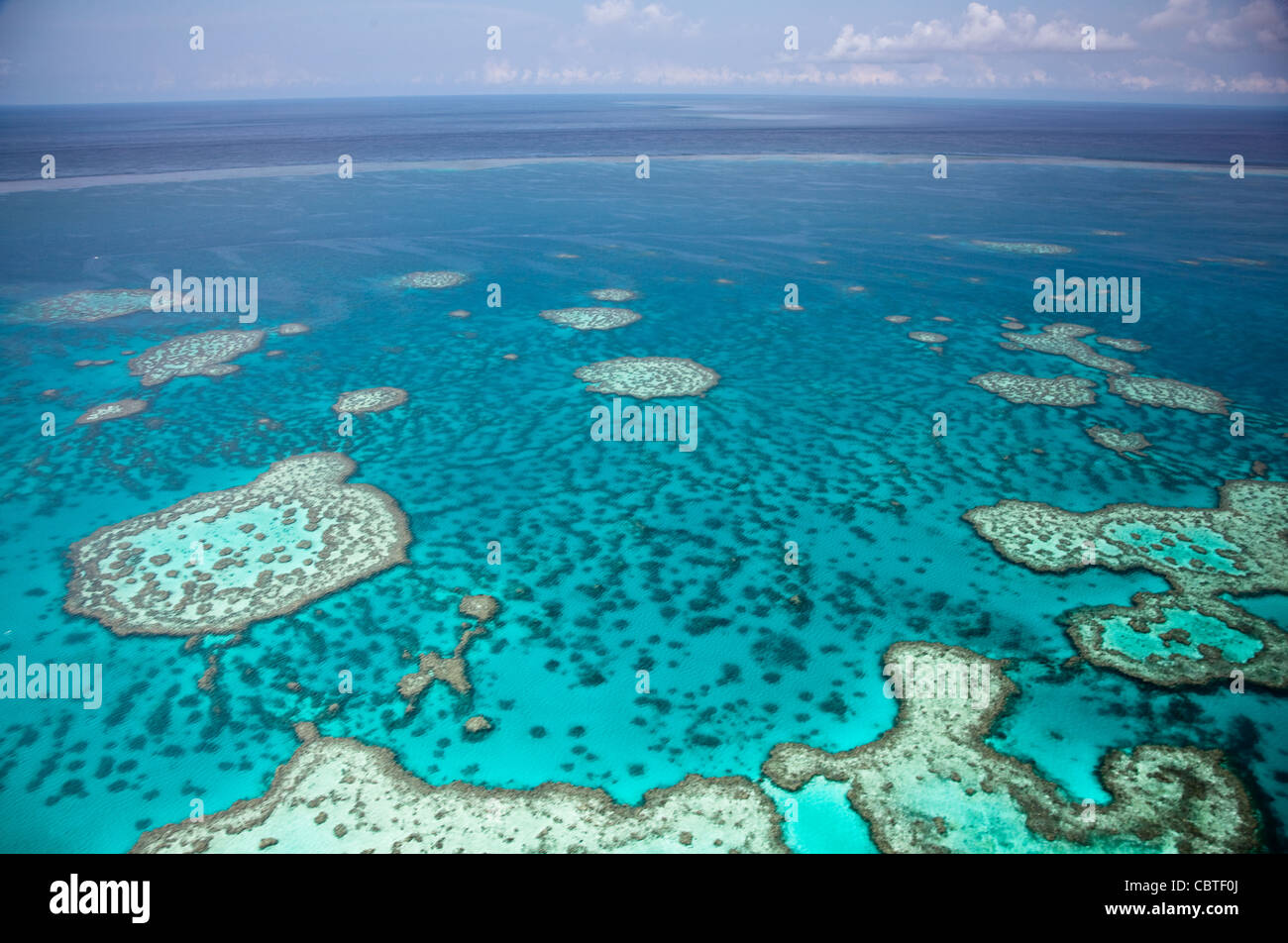 Aerial views of the spectacular Great Barrier Reef near the Whitsunday Islands in Queensland, Australia. Stock Photo