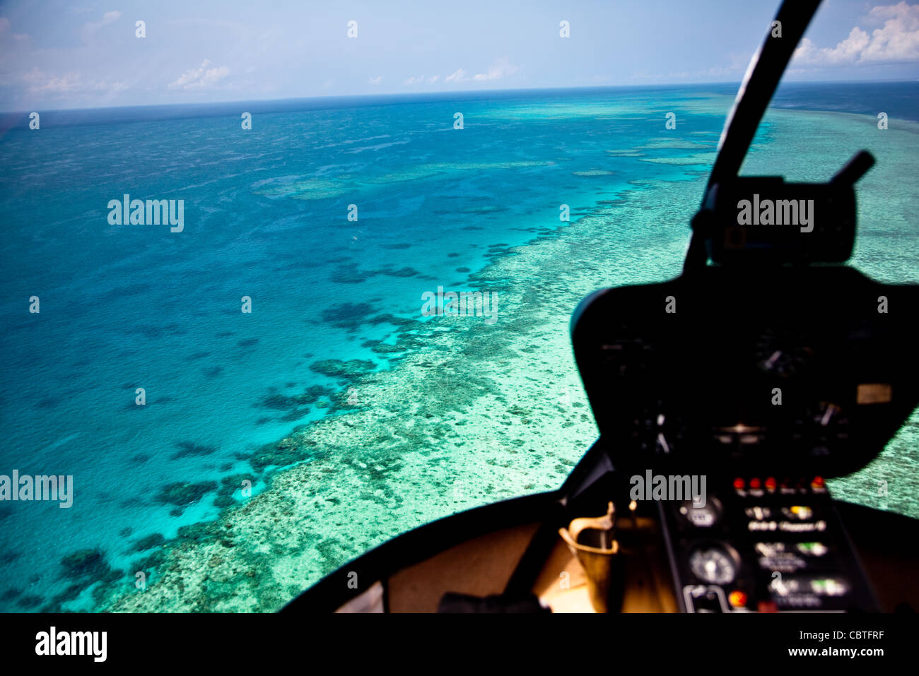 Aerial views incorporating the helicopter interior over the stunning Great Barrier Reef, Australia. Stock Photo