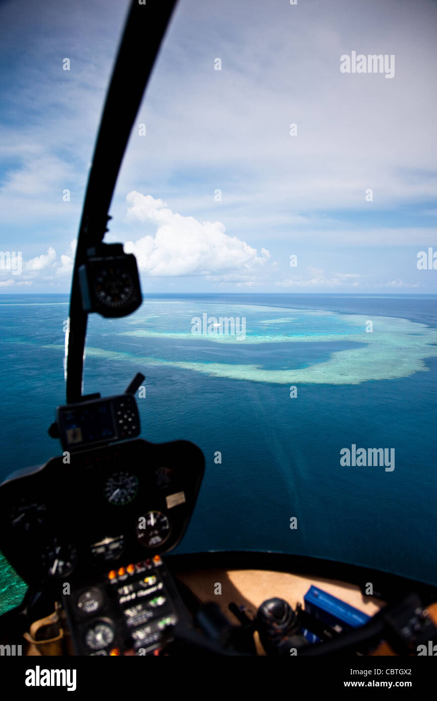 Aerial views incorporating the helicopter interior over the stunning Great Barrier Reef, Australia. Stock Photo