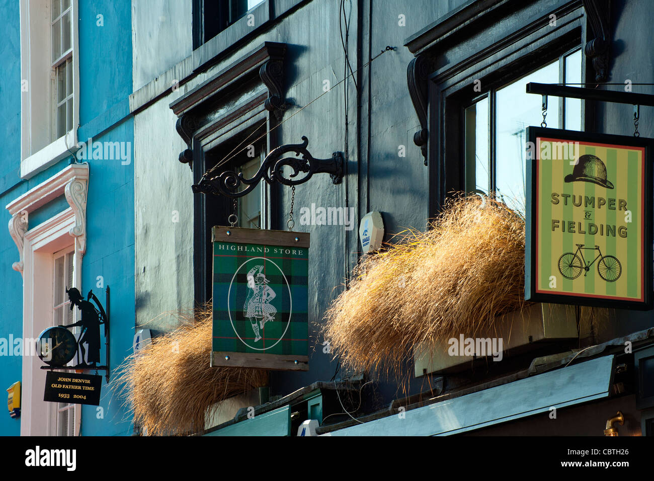 LONDON, UK - OCTOBER 01, 2011:  Signs hanging above shops in Portobello Road Stock Photo