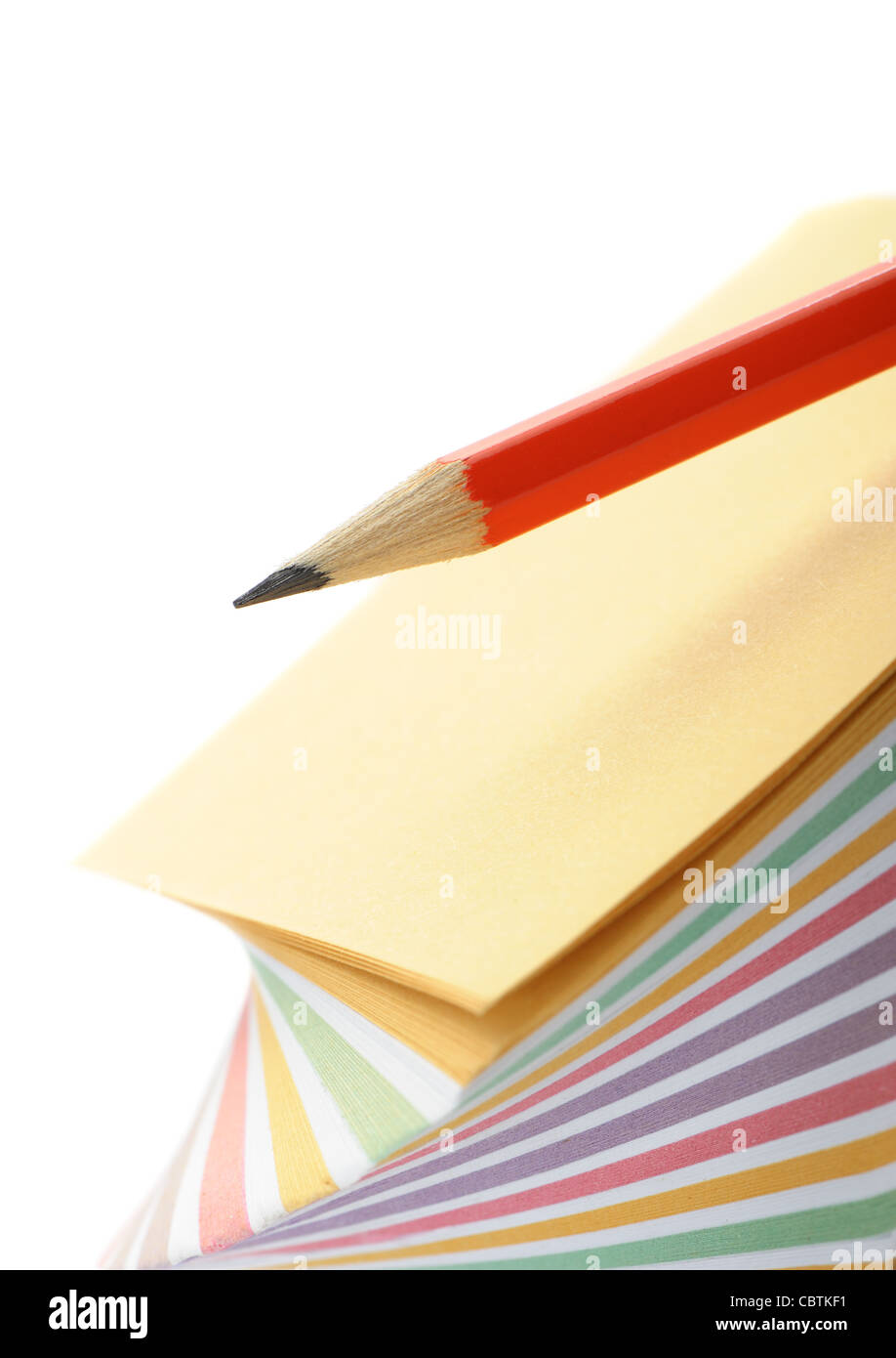 Paper note and a red pencil. It is isolated on a white background Stock ...