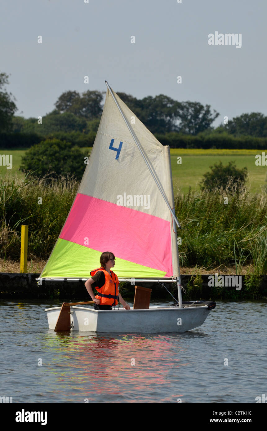 child sailing optimist dinghy Stock Photo