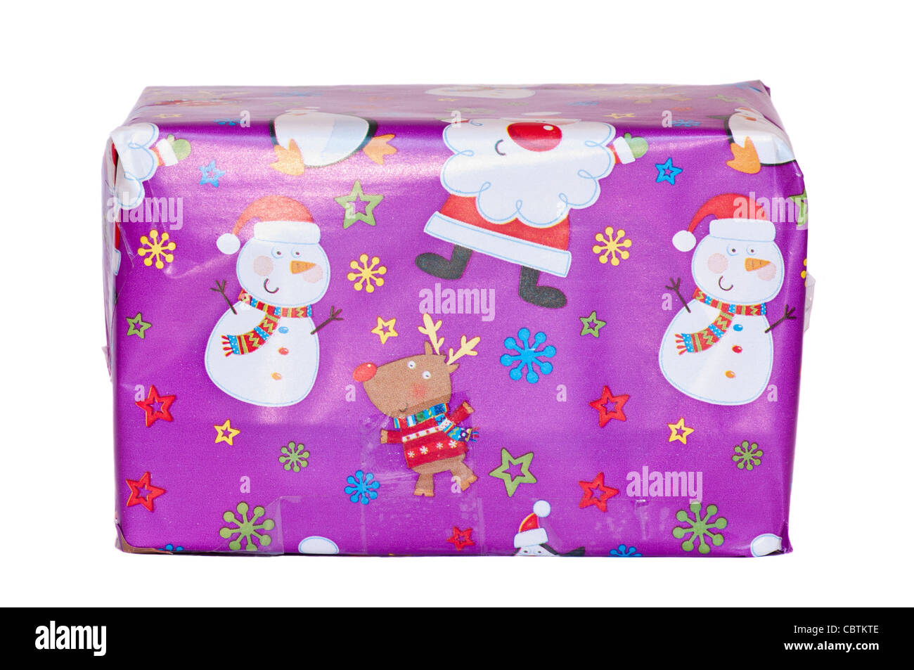 Christmas Present Wrapped In Xmas Gift Wrapping Paper Stock Photo