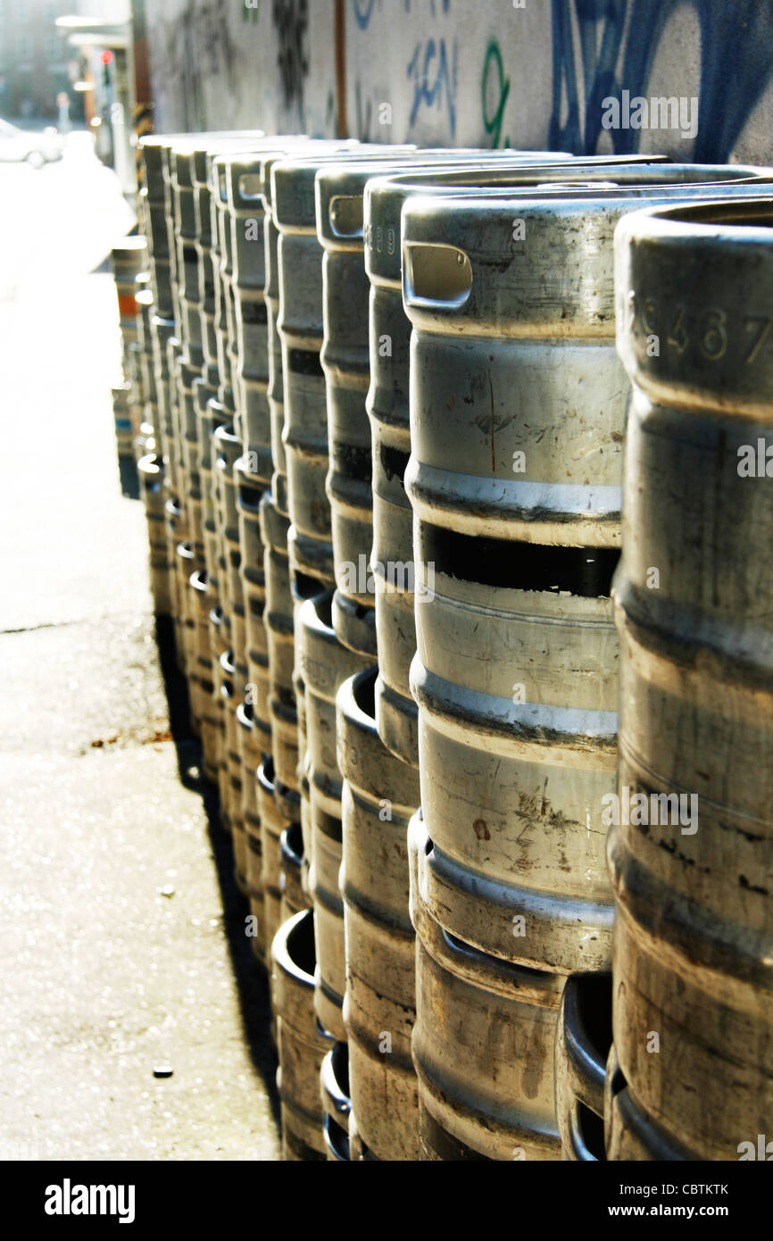 Beer kegs stacked outside bar Stock Photo
