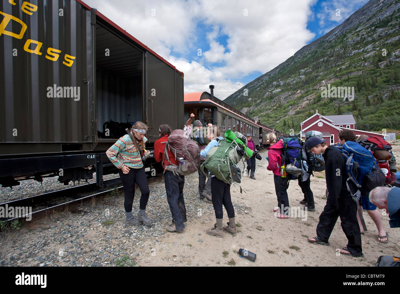 Trekkers uploading their backpacks into the train. Bennett (final stop of the Chilkoot Trail). British Columbia. Canada Stock Photo
