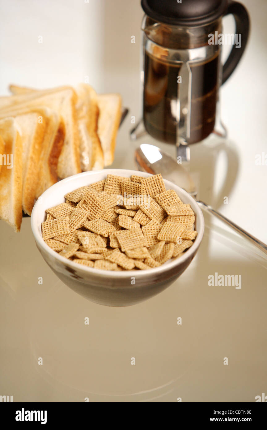 Breakfast cereal on a glass table with coffee, Orange Juice, toast, boiled egg Stock Photo