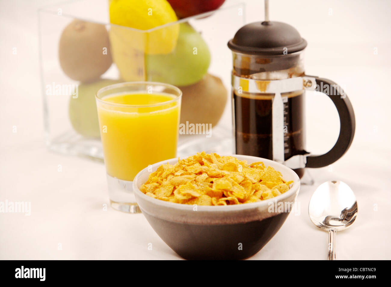 Breakfast cereal on a glass table with coffee, Orange Juice, toast, boiled egg Stock Photo