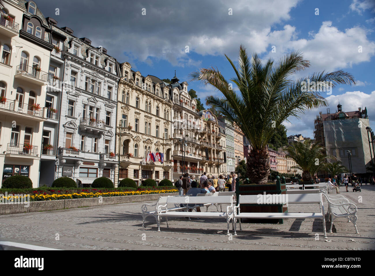 Karlovi Vari - Karlsbad resting benches in front of hotel buildings. Western Bohemia, Czech Republic Stock Photo