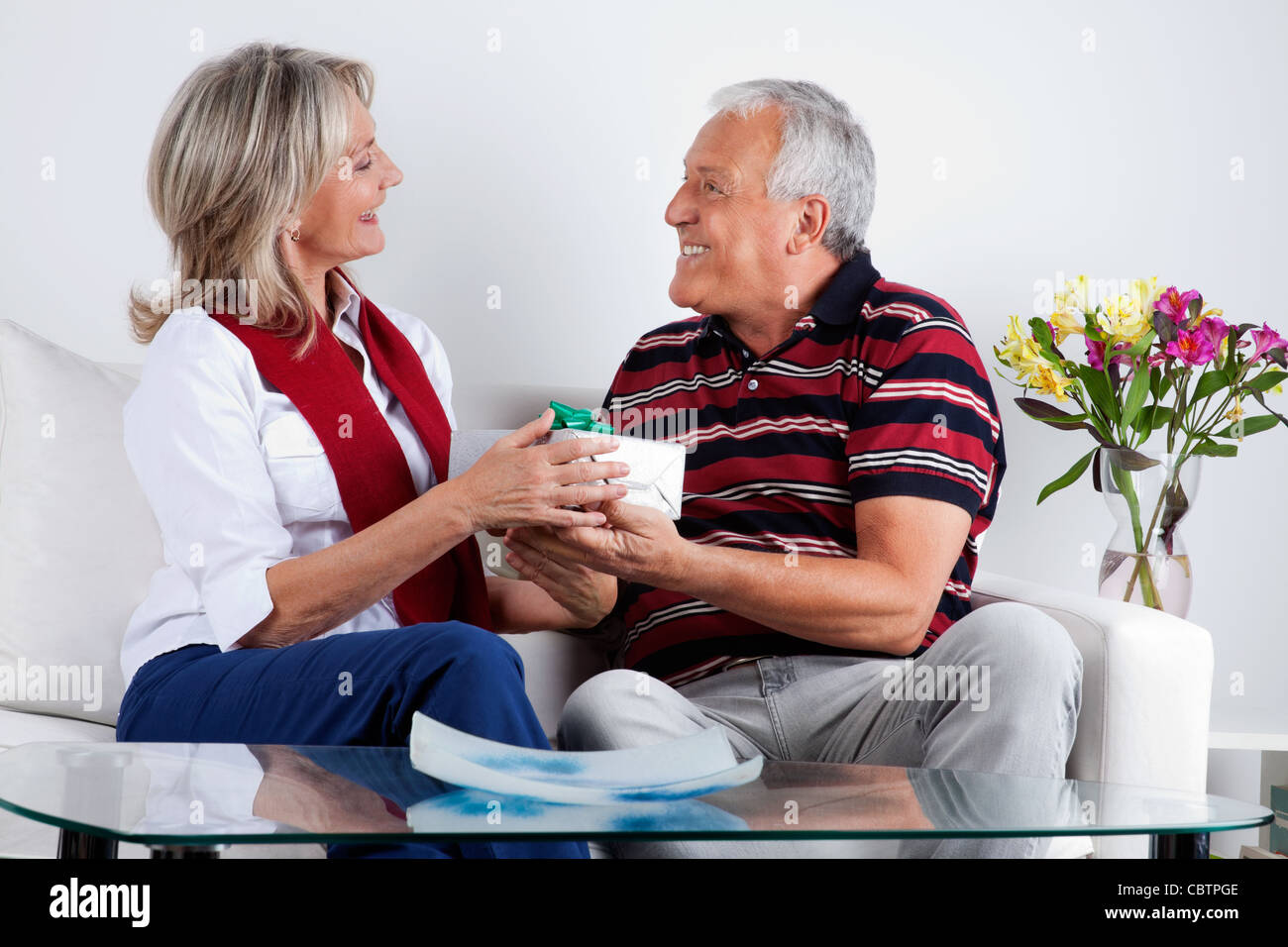 Loving husband giving gift to his wife Stock Photo Alamy
