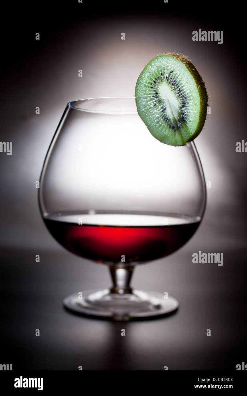 Cognac Glass with kiwi fruit Stock Photo