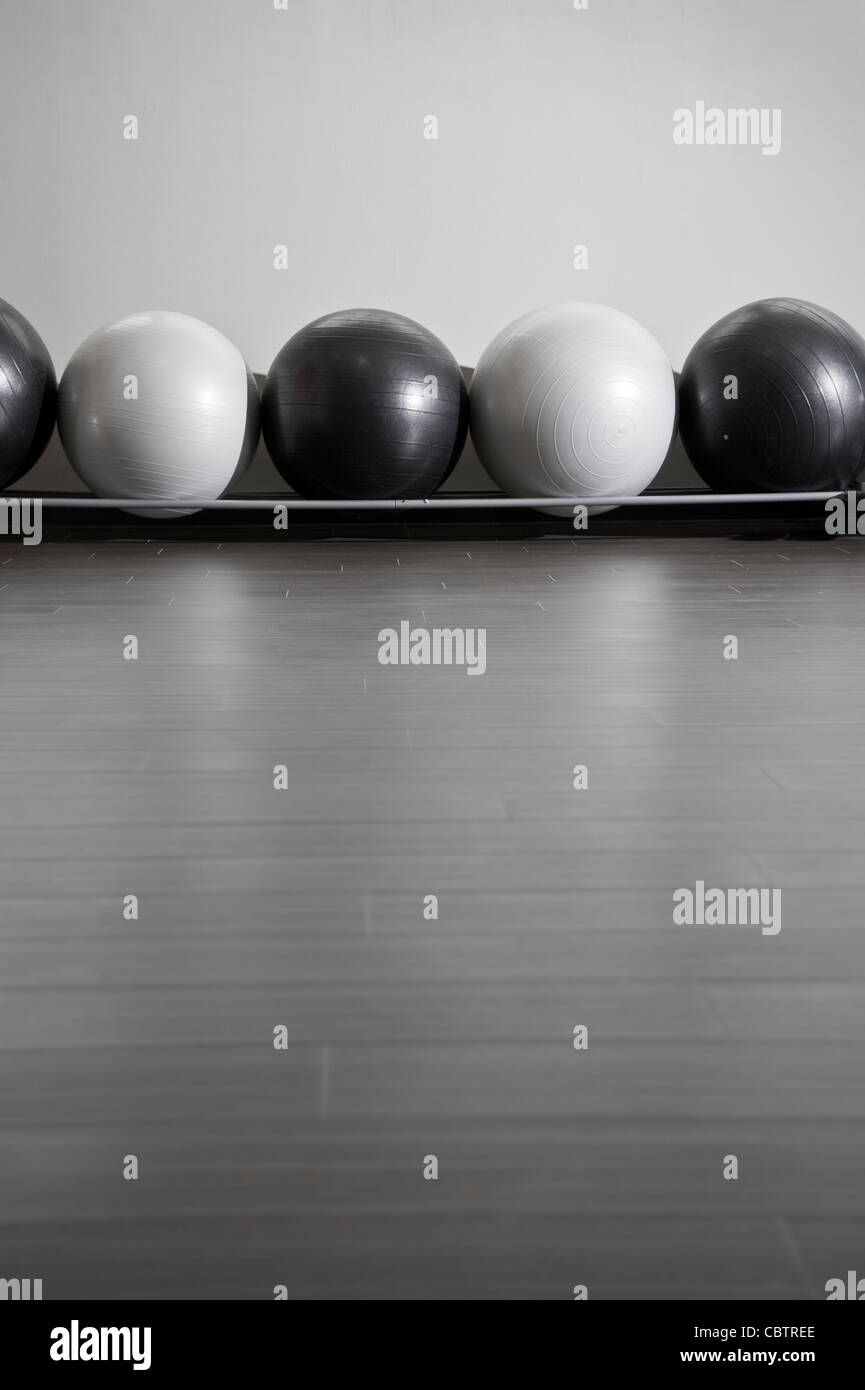 Row Of Exercise Balls At Fitness Center Stock Photo