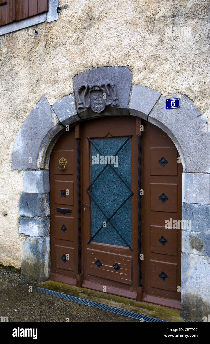 Medieval arched doorway in the small town of Arudy France. Stock Photo
