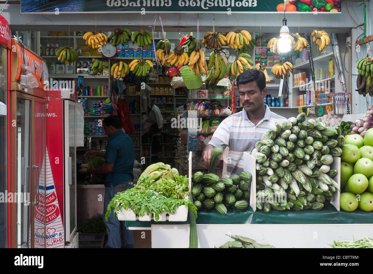 A customer in a fruit and vegetable shop in Little India, Singapore