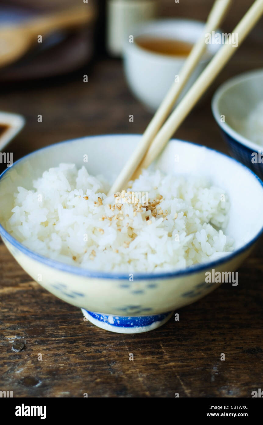 Bowl of rice and chopsticks Stock Photo Alamy