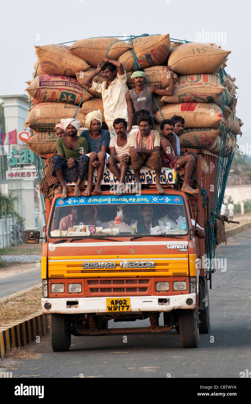 Stock photo of Typical rural transport, overloaded van with people,  Maharashtra, India. Available for sale on