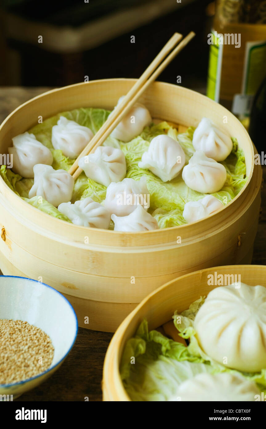 Asian dumpling in steamer with cabbage Stock Photo