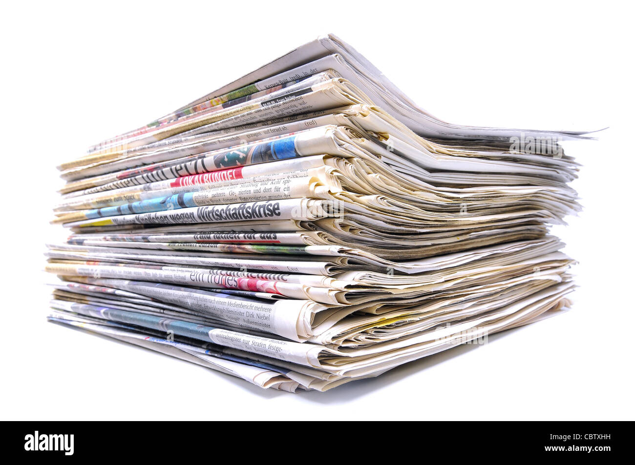 Pile of various newspapers over white background Stock Photo