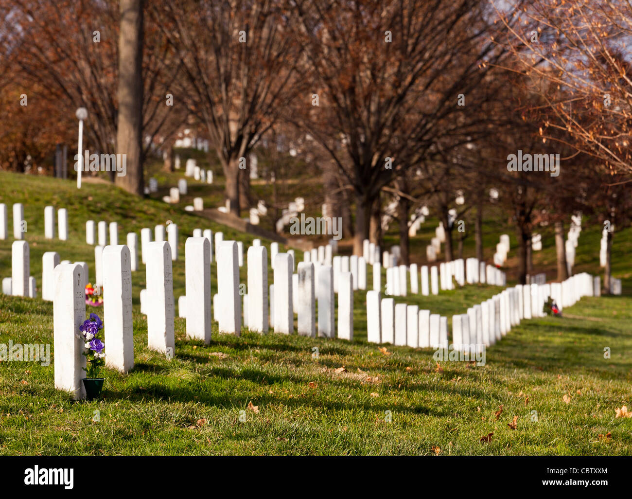 Christmas wreaths on gravestones in Arlington National Cemetery. The wreathes have been donated each year since 1992. Stock Photo