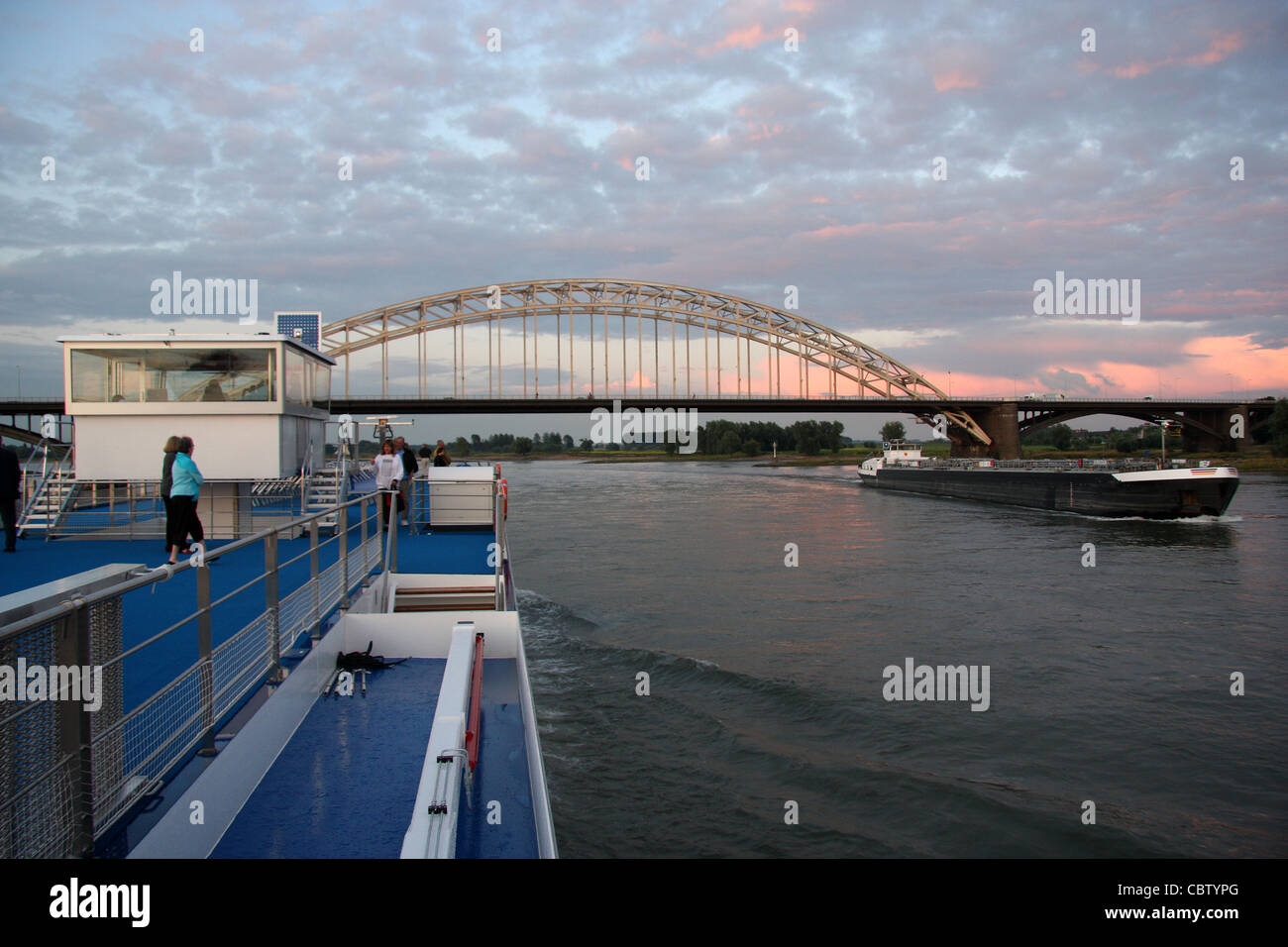 From the Viking Legend looking upstream at the Waalbrug arch bridge at Nijmegen (WW II-a bridge too far) slightly soft focus Stock Photo