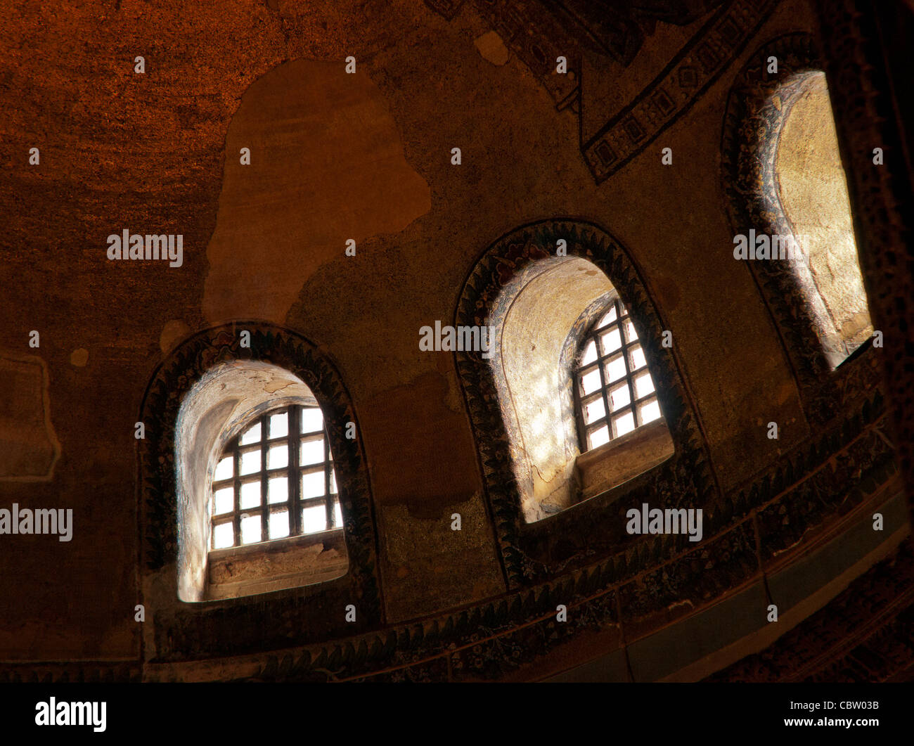 Windows and gold mosaics on a dome of Hagia Sophia (Aya Sofya) basilica, Sultanahmet, Istanbul, Turkey Stock Photo