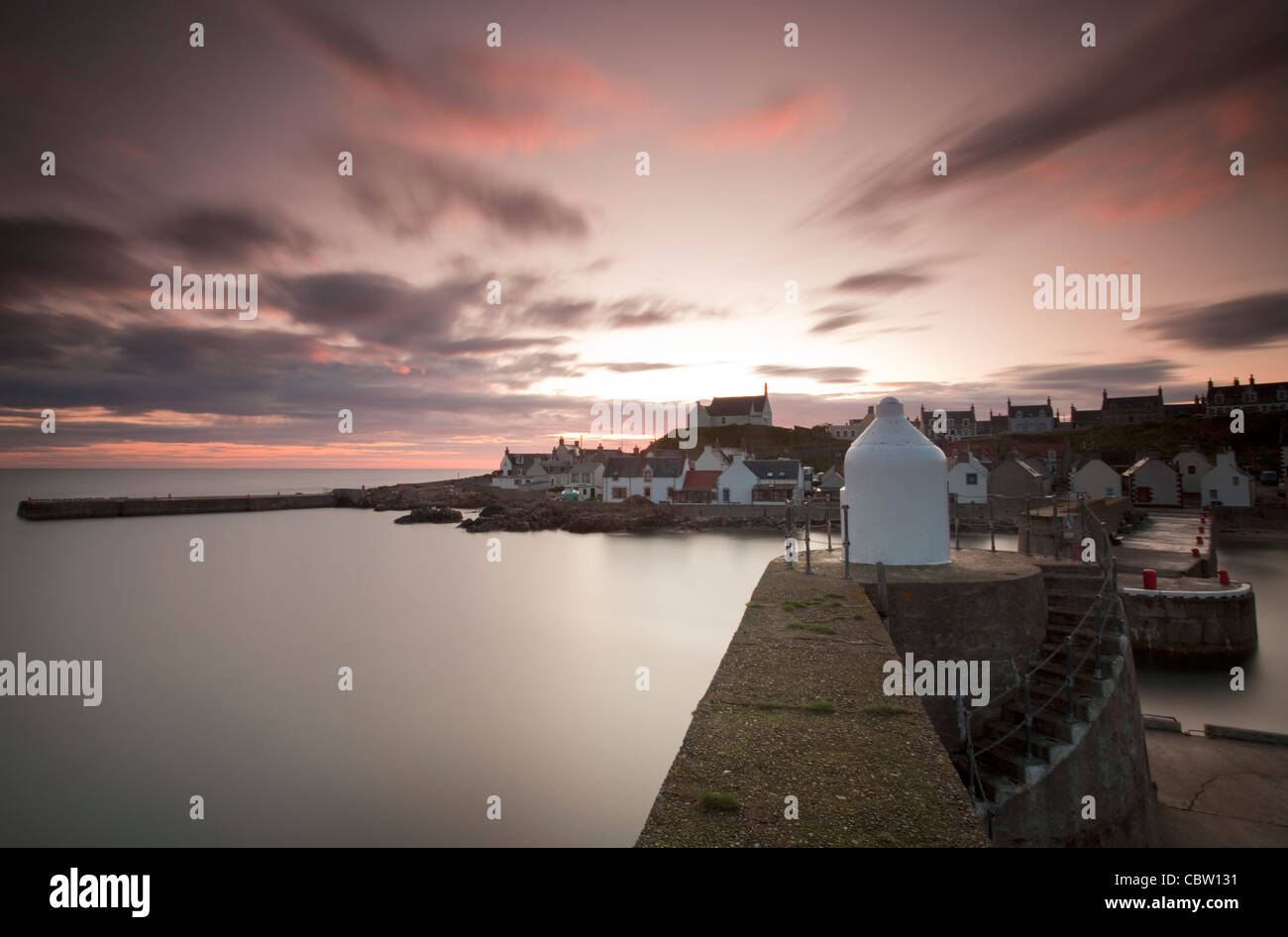 Sunrise and long exposure at Findochty fishing village on the Moray Firth. Stock Photo