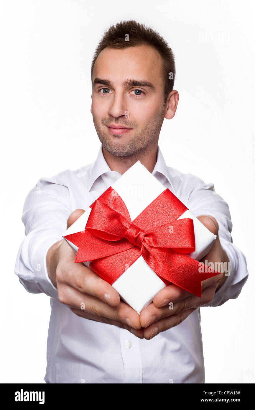 Man Getting Gift young handsome male giving a gift, over white background Stock Photo ...