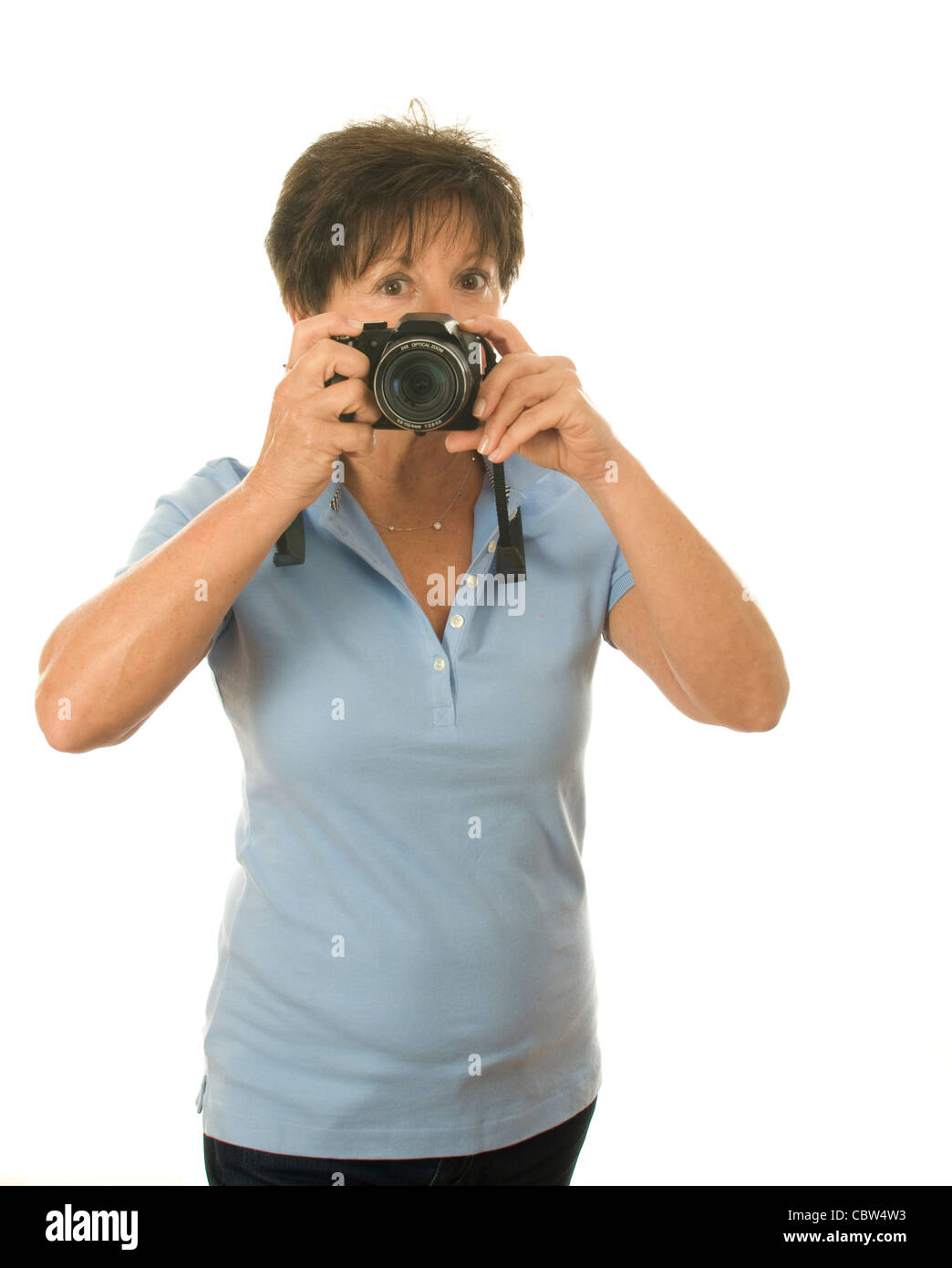 cute middle age senior woman photographer with camera taking photo Stock Photo