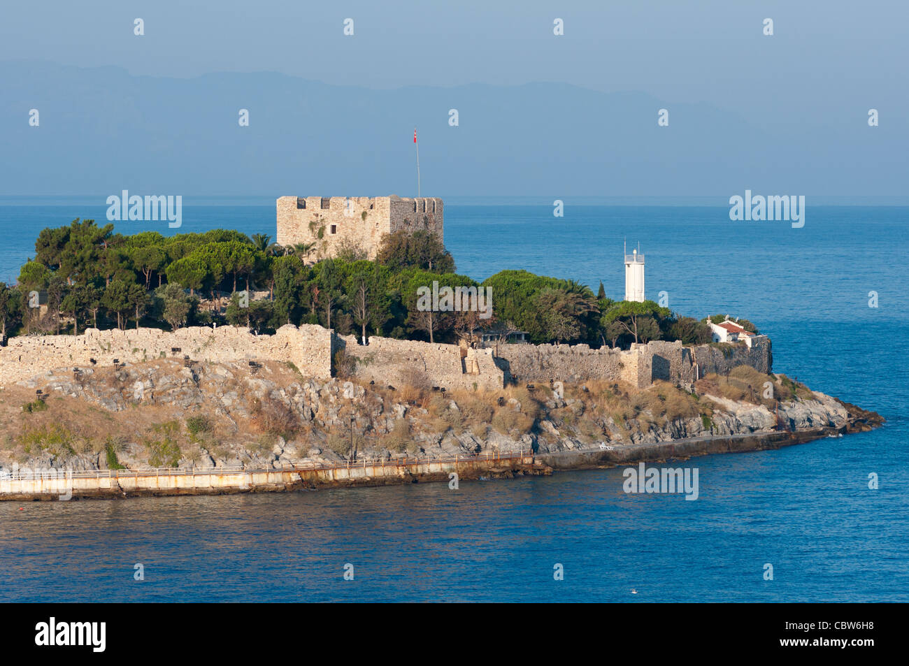 Turkey, Kusadasi. Tiny island of Guvercin Adasi (aka Dove Island) in the Aegean Sea, 14th-15th century fortress. Stock Photo